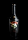 LONDON, UK - JUNE 02, 2020: Bottle of Baileys Original Irish Cream on black. Irish whiskey and cream based liqueur