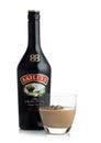 LONDON, UK - JUNE 02, 2020: Bottle and glass of Baileys Original Irish Cream on white. Irish whiskey and cream based liqueur