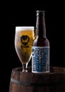 LONDON, UK - JUNE 06, 2018: Bottle and glass of Vagabond Gluten free american pale ale beer, from the Brewdog brewery on old Royalty Free Stock Photo