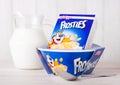 LONDON, UK - JUNE 01, 2018: Box of Kellogg`s Frosties Breakfast Cereal with milk and plate on white wood. Royalty Free Stock Photo