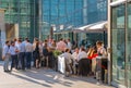 Business people and office workers walking next to Lloyds building in the City of London during lunch time