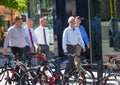 Business people and office workers walking next to Lloyds building in the City of London during lunch time