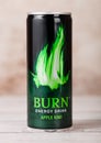 LONDON, UK - JUNE 30, 2018: Can of Burn Energy Drink Original on wood. Burn energy is made for keeping eyes open and mind sharp.Ap