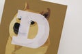 LONDON, UK - June 2021: Doge or dogecoin cryptocurrency logo on paper Royalty Free Stock Photo