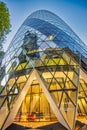 LONDON, UK - JUNE 2015: The modern glass buildings of the Swiss Re Gherkin. This tower is 180 meters tall and stands in the City Royalty Free Stock Photo