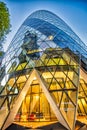 LONDON, UK - JUNE 2015: The modern glass buildings of the Swiss Re Gherkin. This tower is 180 meters tall and stands in the City Royalty Free Stock Photo