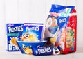 LONDON, UK - JUNE 01, 2018: Pack and box of Kellogg`s Frosties Breakfast Cereal with milk and plateon white wood.