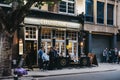 People drinking outside the College Arms pub in Bloomsbury, London, UK