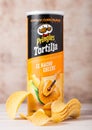 LONDON, UK - JUNE 30, 2018: Pringles potato tortilla chips with cheese on wood. Potato and wheat-based stackable snack. Royalty Free Stock Photo