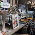 Spitalfields Antic Market. Display. Vintage teddy bear among antique items