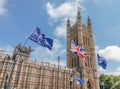 London / UK - June 26th 2019 - European Union and Union Jack flags held up outside UK Parliament by Pro-EU anti-Brexit protesters