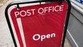 A Post office open sign, London, UK.