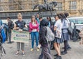 London / UK - June 26th 2019 - Teacher and a group of students holding sign about climate change