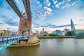 LONDON, UK - JUNE 30TH, 2015: Tower Bridge and modern city buildings exterior at sunset with river reflections on the Thames Royalty Free Stock Photo