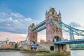 LONDON, UK - JUNE 30TH, 2015: Tower Bridge and modern city buildings exterior at sunset with river reflections on the Thames Royalty Free Stock Photo