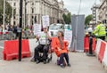 London / UK - June 26th 2019 - Two People`s Vote protesters holding Stop Brexit signs at a road crossing outside Parliament