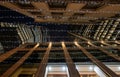 London, UK: Looking up in the City of London at night with 22 Bishopsgate and Tower 42