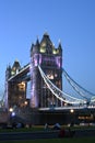 London UK, Majestic Tower Bridge at night with light trails of bus and cars, artistic long exposure night shot