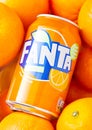 LONDON, UK - MARCH 31, 2018: Aluminium tin of Fanta orange soft drink in oranges Royalty Free Stock Photo