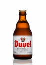 LONDON,UK - MARCH 30, 2017 : Bottle of Duvel Beer on white. Duvel is a strong golden ale produced by a Flemish family-controlled