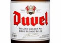 LONDON,UK - MARCH 30, 2017 : Bottle label of Duvel Beer on white. Duvel is a strong golden ale produced by a Flemish family-contr