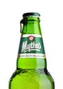 LONDON, UK - MARCH 15, 2017: Bottle of Mythos beer on white. Made by the Mythos Brewery company, the popular brand was launched i