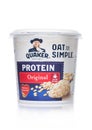 LONDON, UK - MARCH 01, 2019: Cup of Quaker Oat so Simple Porridge Protein Original on white background. Just add water