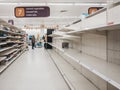 Empty shelves in canned goods and toiler paper aisle of Sainsburys supermarket in Golders Green, London, UK. Royalty Free Stock Photo