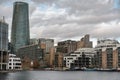 London, UK - March 05, 2019: Flats and houses along the banks of Canary Wharf, oversee river side apartments