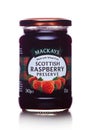 LONDON, UK - MARCH 10, 2018 : Glass jar of Mackays Scottish Raspbery Preserve on white.