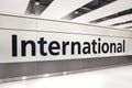 LONDON, UK - MARCH 28, 2015: International arrivals sign. Interior of Heathrow airport Terminal 5. New building Royalty Free Stock Photo