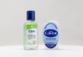 London / UK - March 22nd 2020 - Two bottles of antibacterial hand sanitiser gel from Carex and Cien brands on a white background