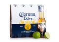 LONDON, UK - MARCH 10, 2018 : Pack of four bottles of Corona extra beer with lime on white.Corona is the most popular imported bee