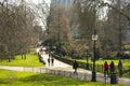 People enjoying a sunny day in London, walking in Hyde Park.