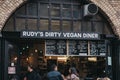 People ordering food from Rudy`s Dirty Vegan Diner inside Camden Market, London, UK