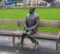 Statue of Mr Bean sitting on a bench. Rowan Atkinson bronze statue in London. UK Royalty Free Stock Photo