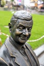 Statue of Mr Bean sitting on a bench. Rowan Atkinson bronze statue in London. UK Royalty Free Stock Photo