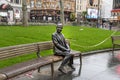 Statue of Mr Bean sitting on a bench. Rowan Atkinson bronze statue in London. UK Royalty Free Stock Photo