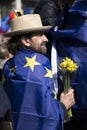A man with a flower and a Europe flag