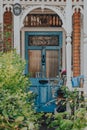 Blue decayed and aged front door of an Edwardian house in London, UK, selective focus