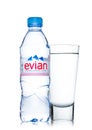 LONDON, UK - MAY 29, 2017: Bottle Of Evian Natural Mineral Water with glass on a white. Made in France.