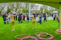 People playing with hula hoop in festival, London