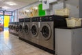 Row of coin laundries and cloth dryers