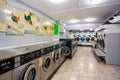 Row of coin laundries and cloth dryers