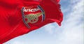 Seamless slow motion with the flag of Arsenal Football Club waving in the wind on a clear day