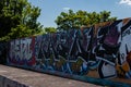 LONDON, UK - MAY 21, 2019 street art paintings panorama on the wall in the park in London, a wall where street artists can present