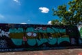 LONDON, UK - MAY 21, 2019 street art paintings panorama on the wall in the park in London, a wall where street artists can present