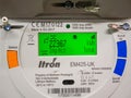 A close-up of a smart meter LCD display, measuring electricity consumption.