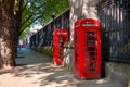 Traditional vintage red K6 telephone kiosk in front of the British Museum