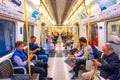 Unidentified people travel by underground train in London, UK